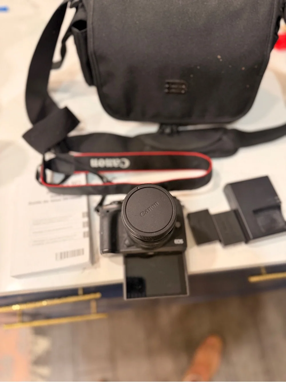 Canon Black Mirrorless Camera with Black Lens and Accessories